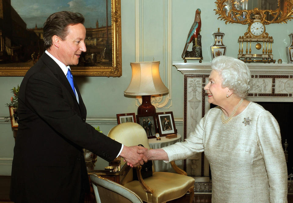 Britain's Queen Elizabeth II greets David Cameron at Buckingham Palace in an audience to invite him to be the next Prime Minister following last week's General Election.