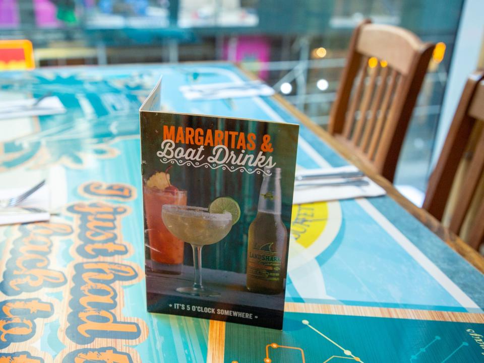 a menu on the table at the two-floor Margaritaville Restaurant