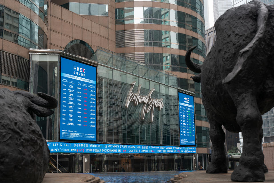 HONG KONG, CHINA - MARCH 12: Electronic signs displaying the Hang Seng Index is seen at the Exchange Square on March 12, 2020 in Hong Kong, China. Hong Kong stocks fell along with global markets on Thursday as a surprise U.S. ban on travel from Europe added to investor fears over the impact of coronavirus. (Photo by Anthony Kwan/Getty Images)