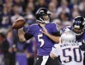 Dec 22, 2013; Baltimore, MD, USA; Baltimore Ravens quarterback Joe Flacco (5) pressured by the New England Patriots defense at M&T Bank Stadium. Mandatory Credit: Mitch Stringer-USA TODAY Sports