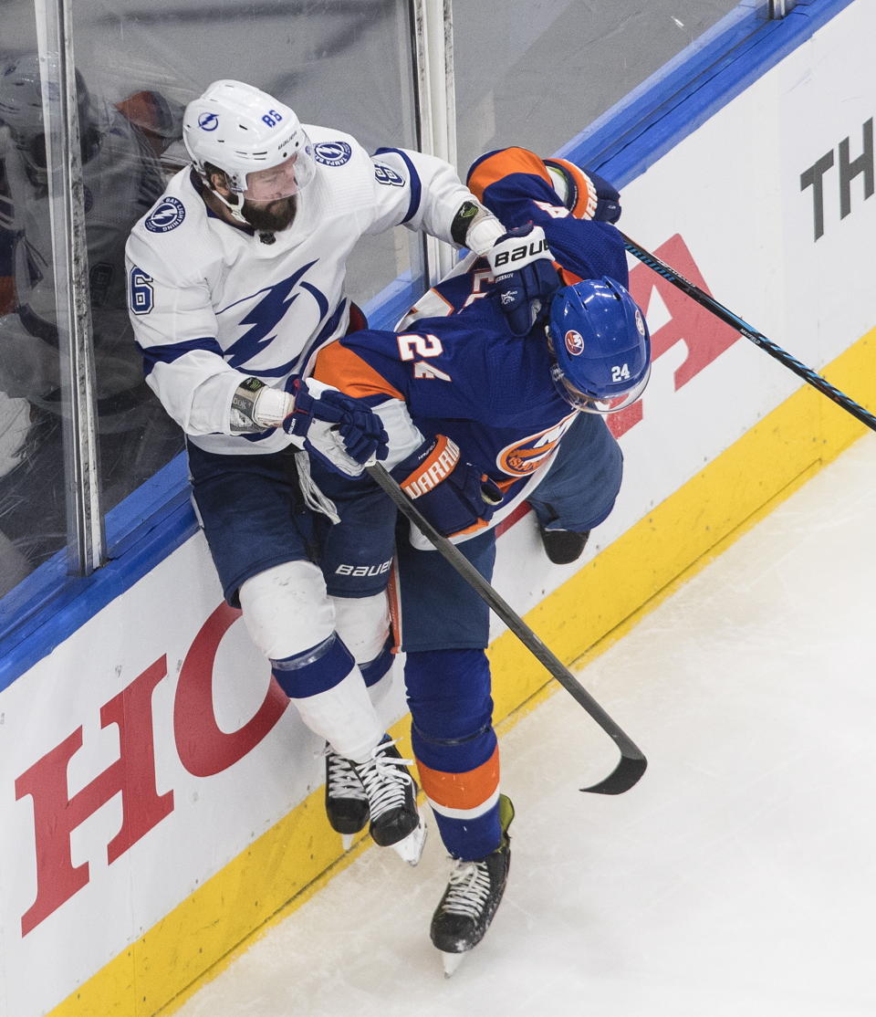 Tampa Bay Lightning right wing Nikita Kucherov (86) is checked by New York Islanders defenceman Scott Mayfield (24) during the third period of Game 6 of the NHL hockey Eastern Conference final, Thursday, Sept. 17, 2020, in Edmonton, Alberta. (Jason Franson/The Canadian Press via AP)