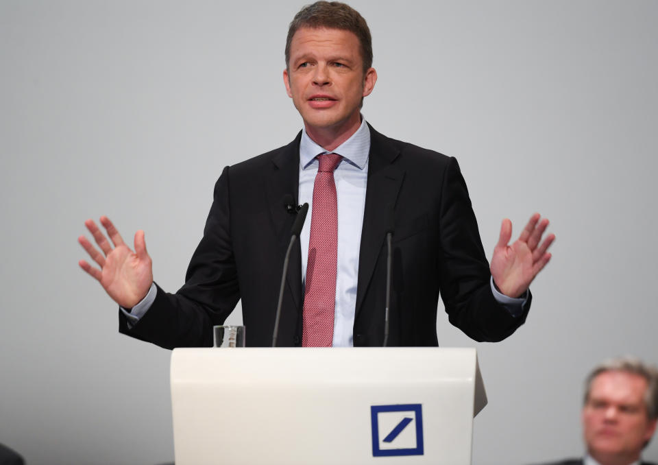 24 May 2018, Germany, Frankfurt: Chairman of the Deutsche Bank, Christian Sewing (R) speaking at the general meeting in the Frankfurt festival hall. The bank is planning the reduction of thousands of positions. The present number of more than 97,000 will be dropped to under 90,000. The insitute announced the news shortly before the start of the general meeting on Thursday. Photo: Arne Dedert/dpa (Photo by Arne Dedert/picture alliance via Getty Images)