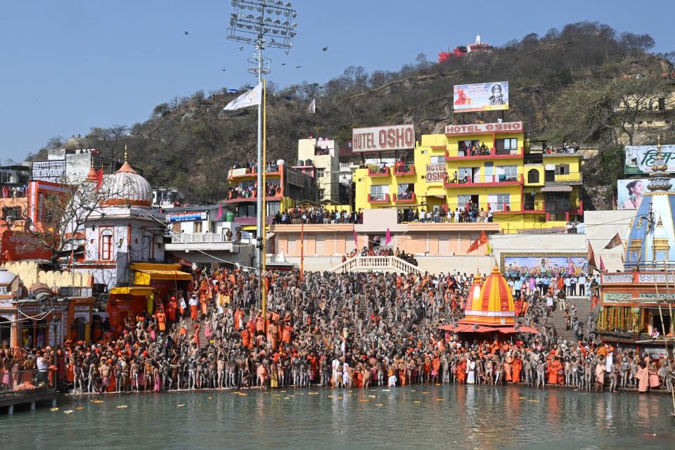 Naga Sadhus (Hindu holy men) gather before taking holy dip in the waters of the River Ganges on the Shahi snan (grand bath) on the occasion of Maha Shivratri festival during the ongoing religious Kumbh Mela festival in Haridwar on March 11, 2021. (Photo by Prakash SINGH / AFP) (Photo by PRAKASH SINGH/AFP via Getty Images)