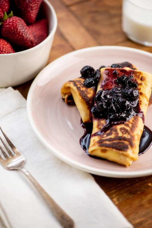 <p>Katie Workman</p><p>These sweet breakfast crepes—or blintzes—are stuffed with a creamy cheese filling, topped with berry sauce, and surprisingly easy to make. Kids will have fun making the filling and folding up the crepes.</p><p><strong>Get the recipe: <a href="https://themom100.com/recipe/creamy-stuffed-breakfast-crepes/" rel="nofollow noopener" target="_blank" data-ylk="slk:Creamy Stuffed Breakfast Crepes;elm:context_link;itc:0;sec:content-canvas" class="link rapid-noclick-resp">Creamy Stuffed Breakfast Crepes</a></strong></p>