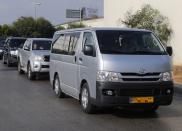 A convoy believed to be carrying a team of the Organisation for the Prohibition of Chemical Weapons (OPCW) leave Beirut international airport September 30, 2013. The team in charge of starting the process of verifying and eliminating Syria's chemical weapons, landed in Beirut on Monday. About 20 of them arrived on a private flight from the Netherlands, a source at Beirut airport said, and are expected to continue on to Damascus this week. (REUTERS/Mohamed Azakir)