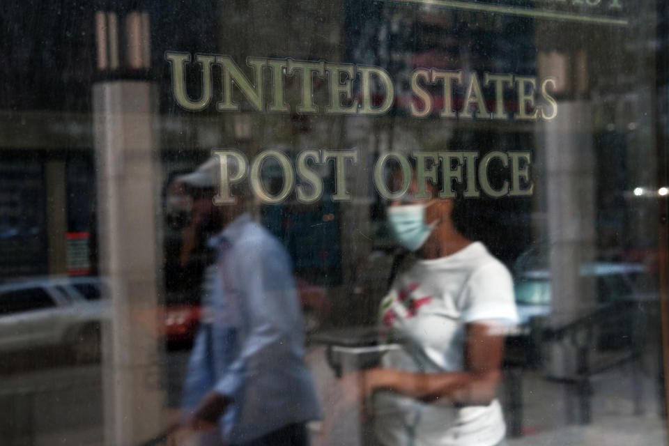 Customers walk into a Brooklyn post office last week in New York City. The U.S. Postal Service is under scrutiny over whether it can handle millions of mail-in ballots. (Photo: Spencer Platt via Getty Images)