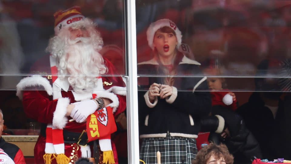 Taylor Swift, right, and Santa Claus — who Travis Kelce later said was her brother Austin — look on during a game between the Las Vegas Raiders and the Kansas City Chiefs at Arrowhead Stadium on December 25, 2023 in Kansas City, Missouri. - Jamie Squire/Getty Images