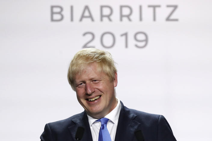 Britain's Prime Minister Boris Johnson smiles during his final press conference at the G7 summit Monday, Aug. 26, 2019 in Biarritz, southwestern France. (AP Photo/Francois Mori)