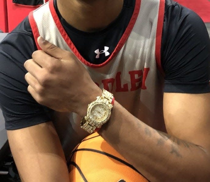 Bradley Braves wing Zek Montgomery chose the gold version of the team's traveling "One More" watch after earning it for a game performance during the 2022-23 season.