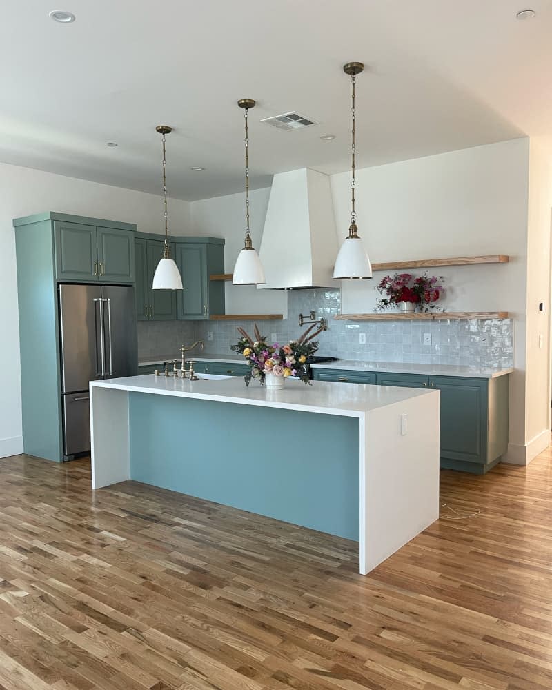 Blue painted cabinets in kitchen before renovations.