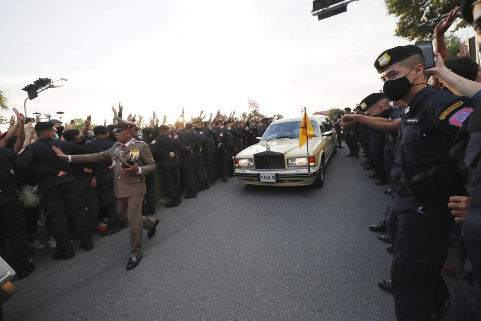 FILE - A vehicle with members of the Thai royal family onboard passes through a road where anti-government protesters gathered outside the Government House in Bangkok, Thailand on Oct. 14, 2020. A Thai court will deliver a verdict on Wednesday, June 28, 2023 in the case of five people accused of impeding the queen’s motorcade during a pro-democracy march in 2020, an offense that if judged egregious could bring a death sentence. (AP Photo/Sakchai Lalit, File)