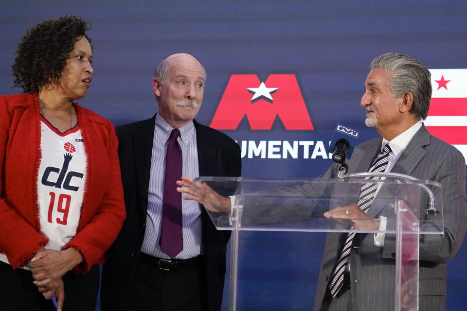 Ted Leonsis, right, owner of the Washington Wizards NBA basketball team and Washington Capitals NHL hockey team, speaks during a news conference with Washington DC Mayor Muriel Bowser, left, and DC Council Chairman Phil Mendelson, center, at Capitol One Arena in Washington, Wednesday, March 27, 2024. (AP Photo/Stephanie Scarbrough)