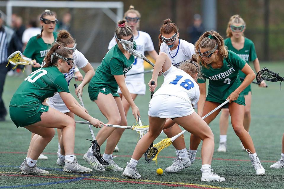 Duxbury and Norwell players battle for a loose ball. 
Norwell girls lacrosse hosts Duxbury on Wednesday, May 4, 2022.