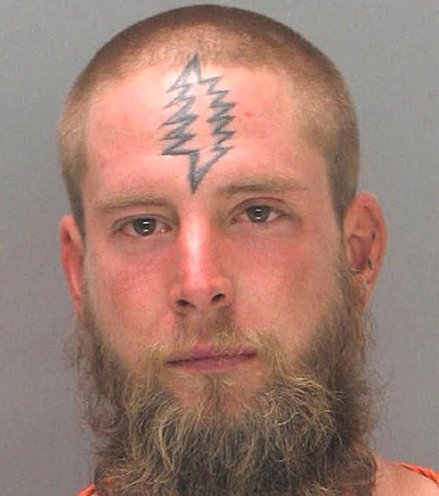 An unidentified bearded man with a tattoo that looks like a Christmas tree (Rex Features)