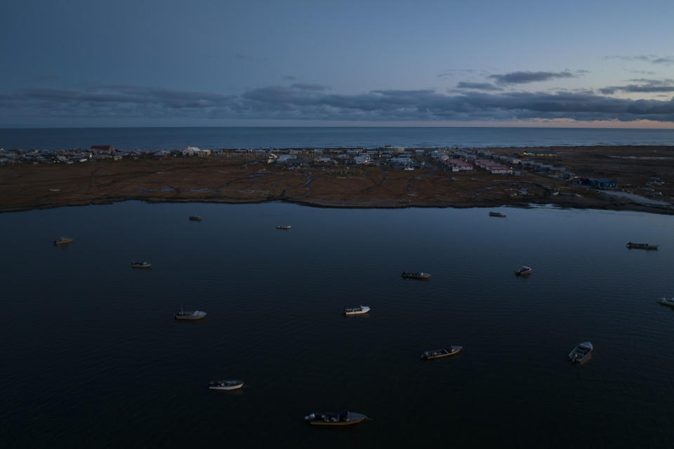 Boats used for seal hunting are kept in the lagoon side of Shishmaref, Alaska, Saturday, Oct. 1, 2022. Climate change is partially to blame for the rising seas, flooding, erosion and loss of protective ice and land that are threatening this Inupiat village of about 600 people near the Bering Strait, just a few miles from the Arctic Circle. (AP Photo/Jae C. Hong)