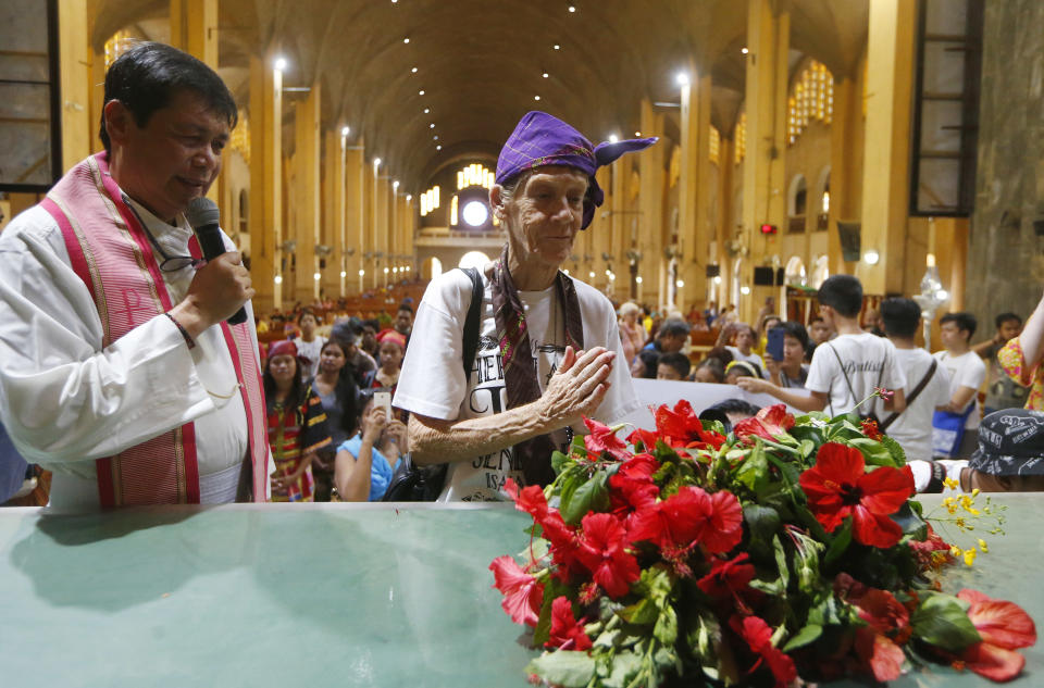 Australian Roman Catholic nun Sister Patricia Fox prays briefly after offering flowers to the image of Our Lady of Perpetual Help during her visit to the Redemptorist Church prior to her departure for Australia Saturday, Nov. 3, 2018 in suburban Paranaque city, south of Manila, Philippines. Sister Fox decided to leave after 27 years in the country after the Immigration Bureau denied her application for the extension of her visa. The Philippine immigration bureau has ordered the deportation of Fox who has angered the president by joining anti-government rallies. (AP Photo/Bullit Marquez)