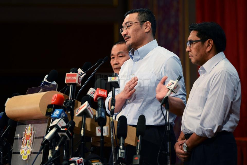 Acting Transport Minister Datuk Seri Hishammuddin Hussein (second from right) says new evidence drawn from Inmarsat data analysis suggests a new search area for flight MH370. – The Malaysian Insider pic by Afif Abd Halim, March 29, 2014.