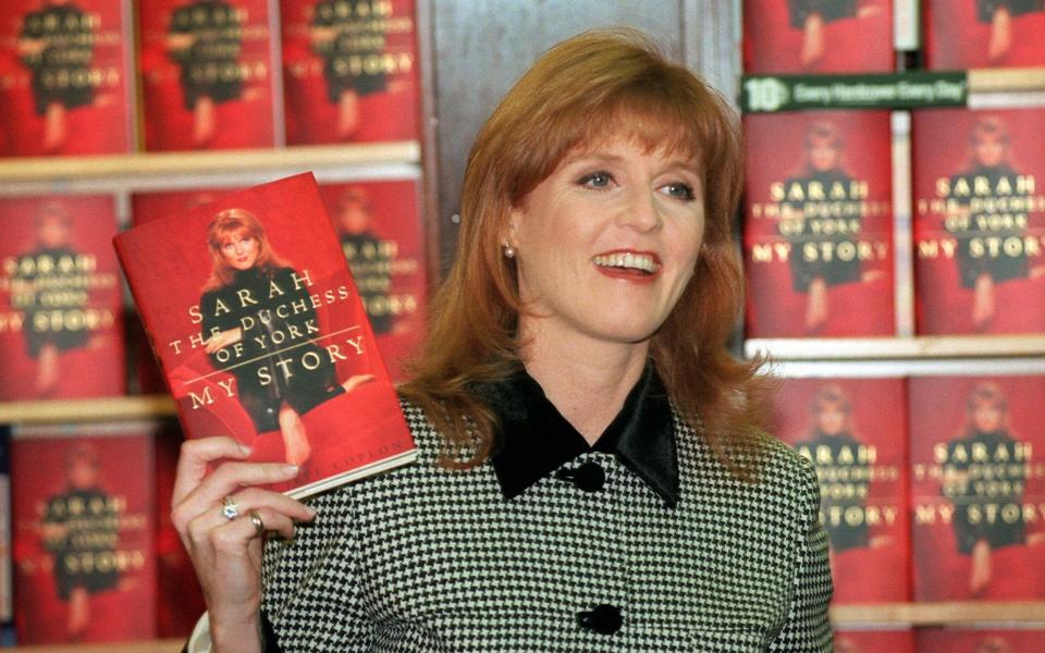 The Duchess of York with a copy of her book, My Story, in 1996 - AP