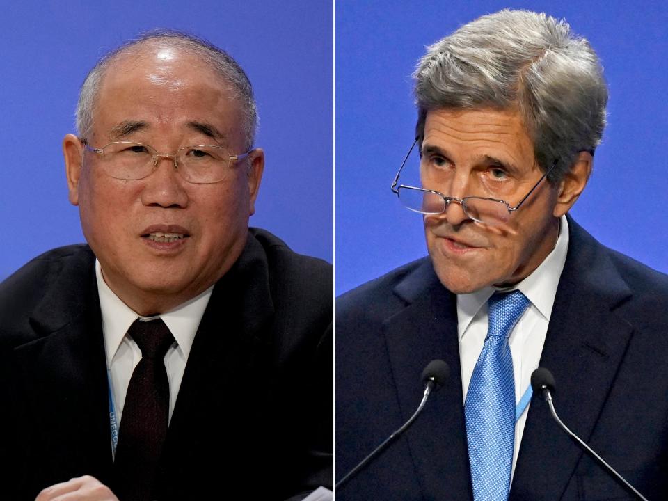 John Kerry in conversation with Xie Zhenhua (AP/Getty)