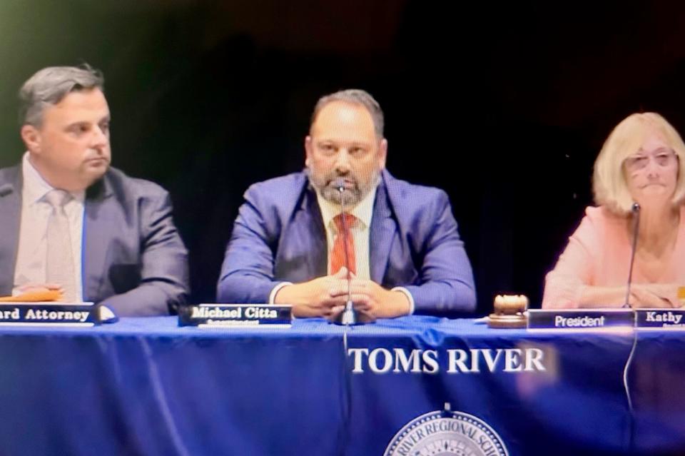 Toms River Regional Board Attorney William Burns, left, Superintendent Mike Citta and Board of Education President Kathy Eagan at the July 3, 2024 school board meeting.