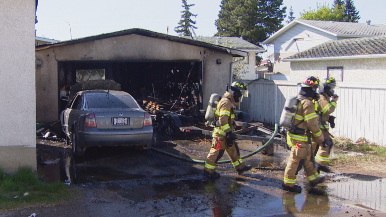 'Heck of a good save' on windy day as Edmonton firefighters keep garage fire from spreading