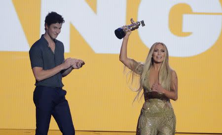2018 MTV Video Music Awards - Show - Radio City Music Hall, New York, U.S., August 20, 2018 - Jennifer Lopez accepts the Michael Jackson Video Vanguard Award as presenter Shawn Mendes applauds. REUTERS/Lucas Jackson