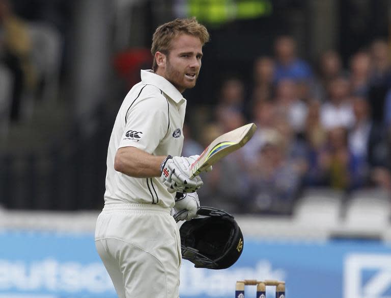 New Zealand's Kane Williamson acknowledges the crowd as he reaches his century on the third day of the first cricket Test match between England and New Zealand at Lord's cricket ground in London on May 23, 2015