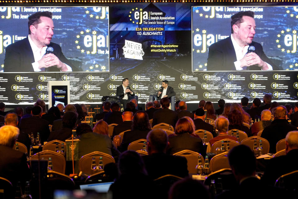 Tesla and SpaceX's CEO Elon Musk is interviewed by Ben Shapiro, right, at the European Jewish Association's conference, in Krakow, Poland, Monday, Jan. 22, 2024. Musk visited earlier in the day the site of the Auschwitz-Birkenau Nazi German death camp in Oswiecim, Poland, the private visit apparently took place in response to calls from some Jewish religious leaders for Musk to see with his own eyes the most symbolic site of the horrors of the Holocaust. (AP Photo/Czarek Sokolowski)