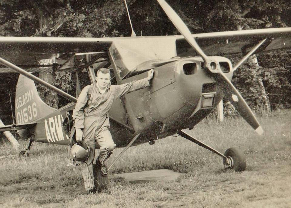 Jim Goetcheus stands in front of his plane in Germany, where he was stationed in the Army from 1960 to 1963. Goetcheus battled against a severe fear of heights to become a pilot in the military. He served as a career military officer for more than 20 years, including two tours in Vietnam where he earned a Purple Heart and a Bronze Star. He wanted to have a funeral at Arlington National Cemetery.