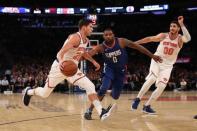 Nov 20, 2017; New York, NY, USA; New York Knicks forward Doug McDermott (20) drives past LA Clippers guard Sindarius Thornwell (0) during the third quarter at Madison Square Garden. Anthony Gruppuso-USA TODAY Sports