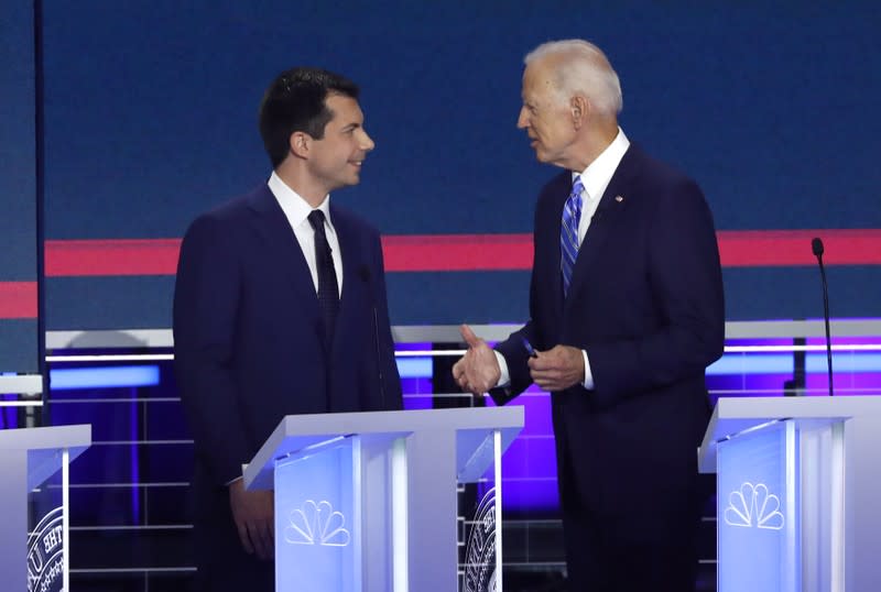 Candidates chat during the second night of the first U.S. 2020 presidential election Democratic candidates debate in Miami, Florida, U.S.