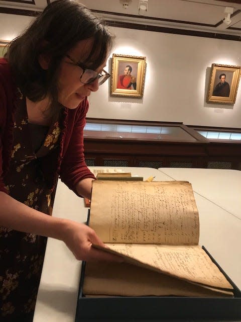 Kimberly Nusco, a librarian at the John Carter Brown Library at Brown University, showed the 1764 accounting book for the Sally, a slave ship that left Providence, Rhode Island and headed toward the West Coast of Africa.