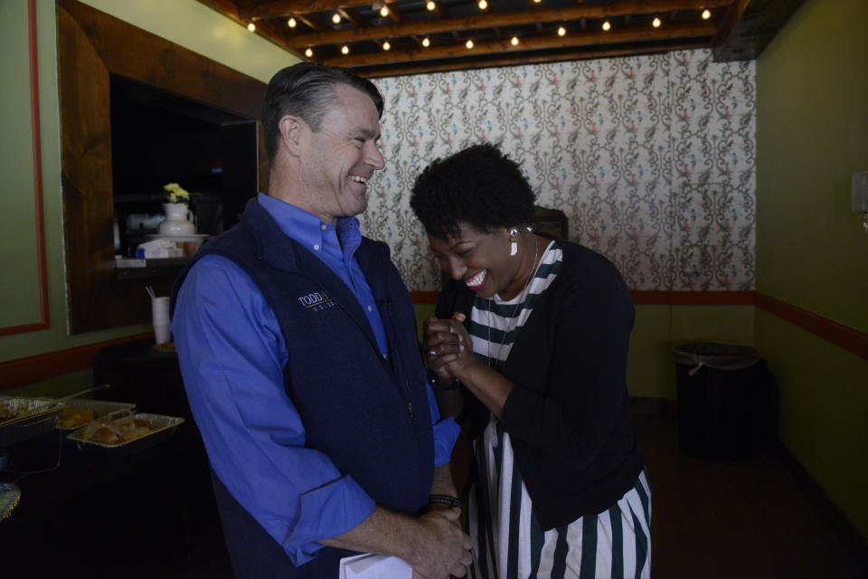 Jennifer-Ruth Green, right, the Republican candidate for Indiana's 1st Congressional District and an U.S. Air Force veteran laughs with U.S. Sen. Todd Young (R-Ind.) left, before a roundtable meeting Thursday, Oct. 20, 2022, in Gary, Ind. (AP Photo/Paul Beaty)