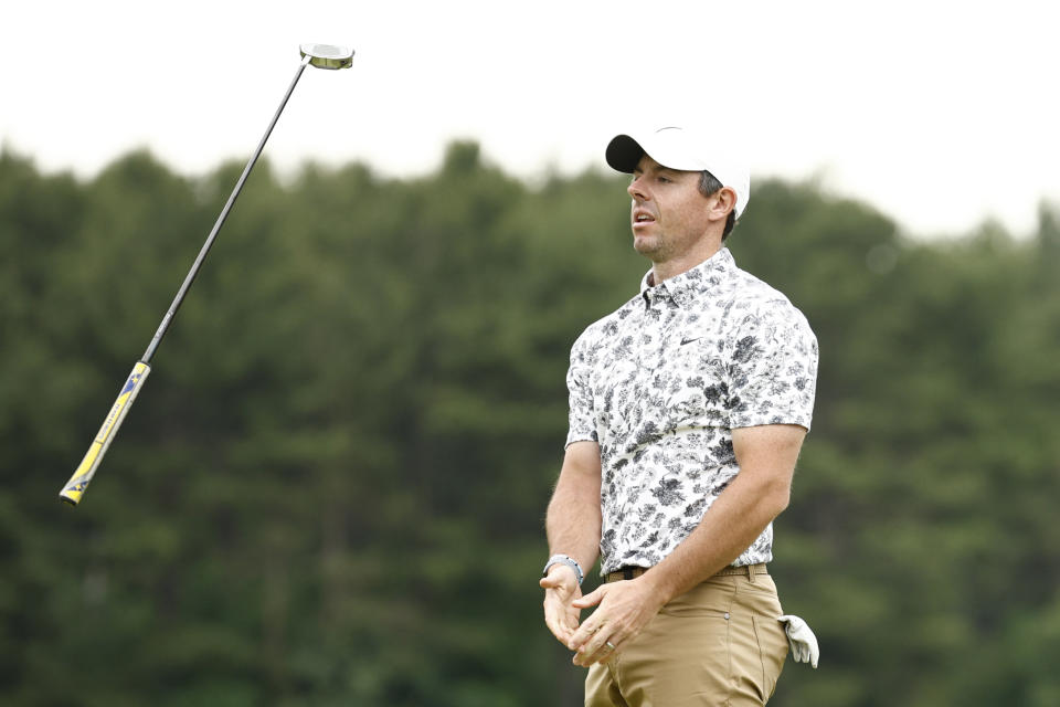 Pictured here, a frustrated Rory McIlroy tosses his putter in the air during the opening round of the US Open.