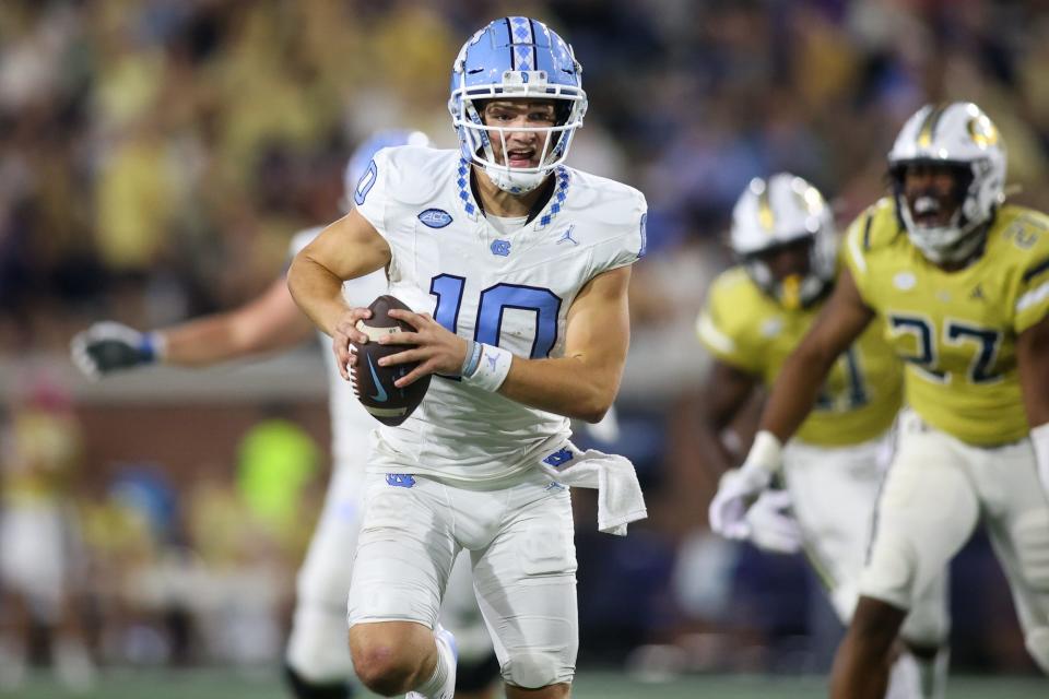 North Carolina Tar Heels quarterback Drake Maye (10) runs the ball against the Georgia Tech Yellow Jackets in the second half at Bobby Dodd Stadium at Hyundai Field.