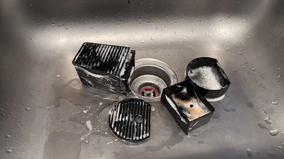 Washing the removable parts of a Nespresso coffee machine
