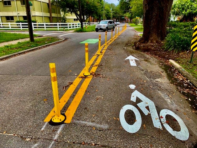 The city of Gainesville installed protected bike lanes on 15th Street north of the University of Florida, a rare example of protected lanes in the area.