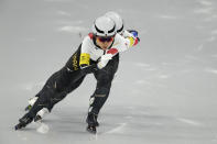 Team Japan, led by Miho Takagi, with Ayano Sato center and Nana Takagi, competes during the speedskating women's team pursuit finals at the 2022 Winter Olympics, Tuesday, Feb. 15, 2022, in Beijing. (AP Photo/Ashley Landis)