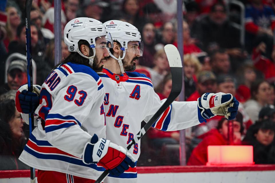 Apr 5, 2024; Detroit, Michigan, USA; New York Rangers left wing Chris Kreider (20) celebrates his goal with center Mika Zibanejad (93) during the third period against the Detroit Red Wings at Little Caesars Arena.