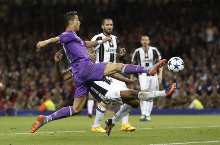 Britain Soccer Football - Juventus v Real Madrid - UEFA Champions League Final - The National Stadium of Wales, Cardiff - June 3, 2017 Real Madrid's Cristiano Ronaldo in action with Juventus' Alex Sandro Reuters / Carl Recine Livepic