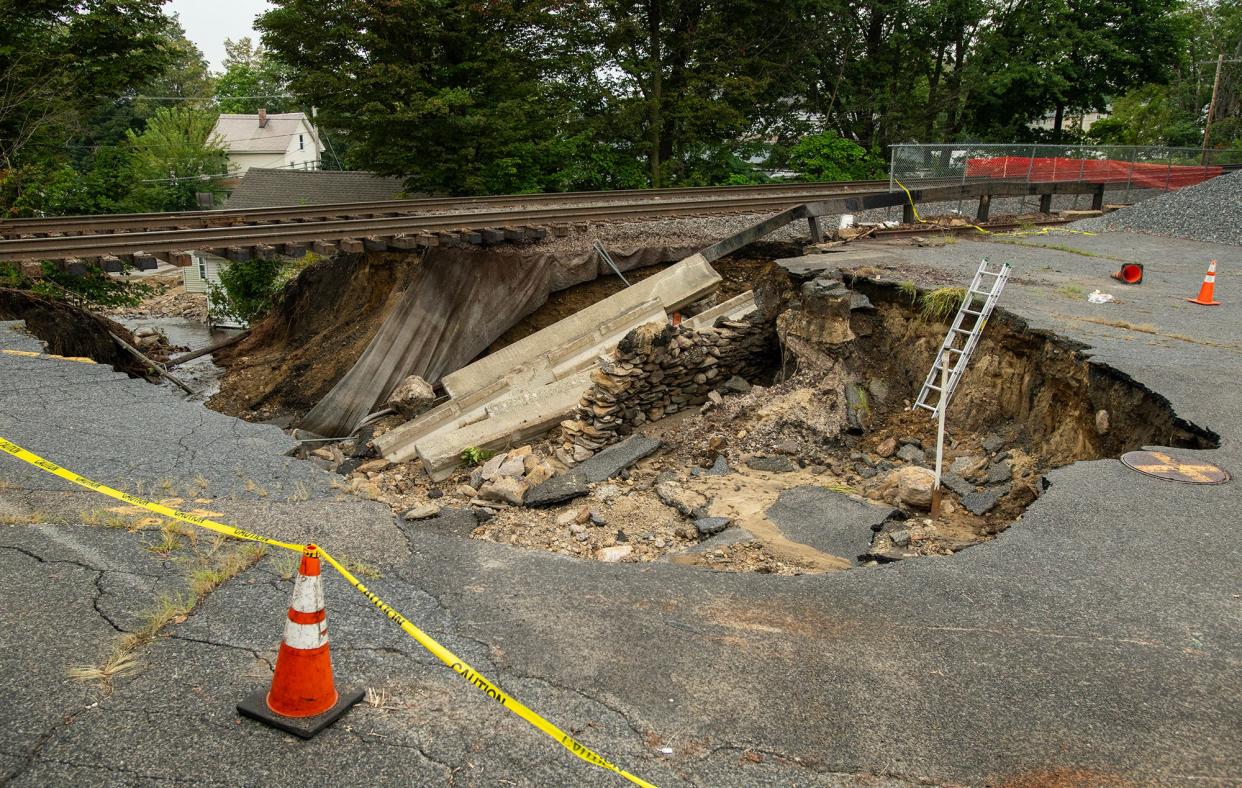 Work continues Wednesday to repair the rail bed that was damaged in Monday's storm. The tracks, near the North Leominster station, carry MBTA commuter rail trains.