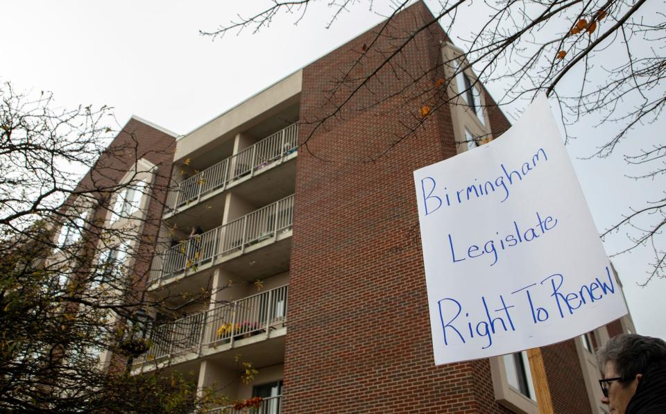 A person holds a sign that reads 'Birmingham Legislate Right to Renew' during a protest in support of Dorothy Conrad, an ex-mayor of Birmingham, outside the Baldwin House Senior, Living in Birmingham on Nov. 4, 2022.