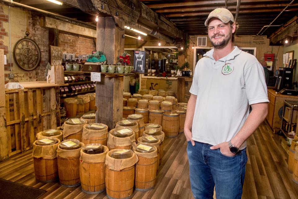 James Cross, owner of Leaves ’n Beans, poses in the company’s store and roastery at 4416 N. Prospect Road in Peoria Heights.
