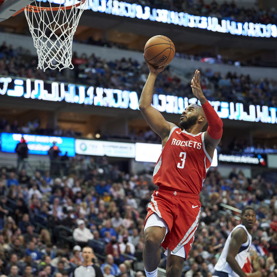 Houston Rockets guard Chris Paul (3) drives to the basket against the Dallas Mavericks during the first half of an NBA basketball game, Saturday, Dec. 8, 2018, in Dallas. (AP Photo/Cooper Neill)