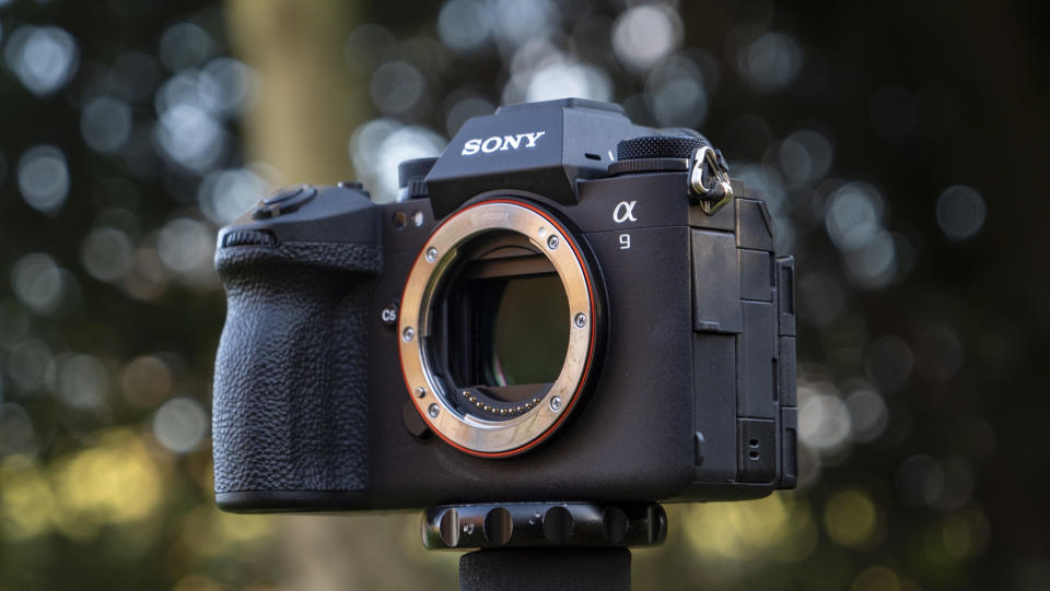 Sony A9 III camera outside with background foliage, no lens attached