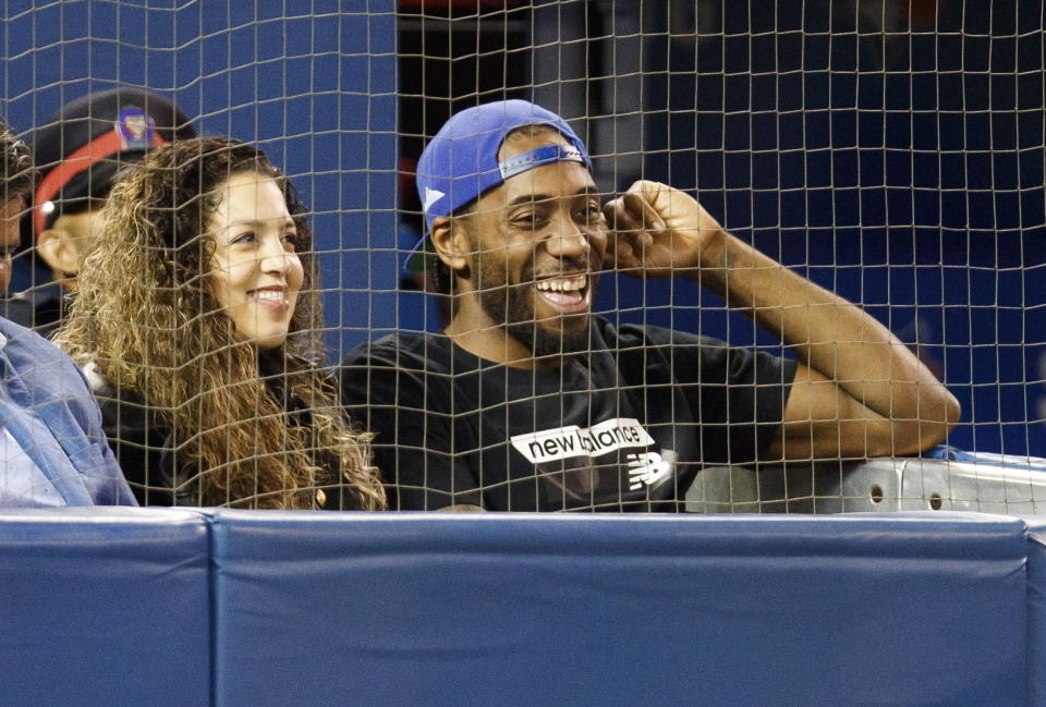 Kawhi Leonard and his girlfriend, Kishele Shipley, watch the Toronto Blue Jays play the Los Angeles Angels during a baseball game Thursday, June 20, 2019, in Toronto. (Mark Blinch/The Canadian Press via AP)