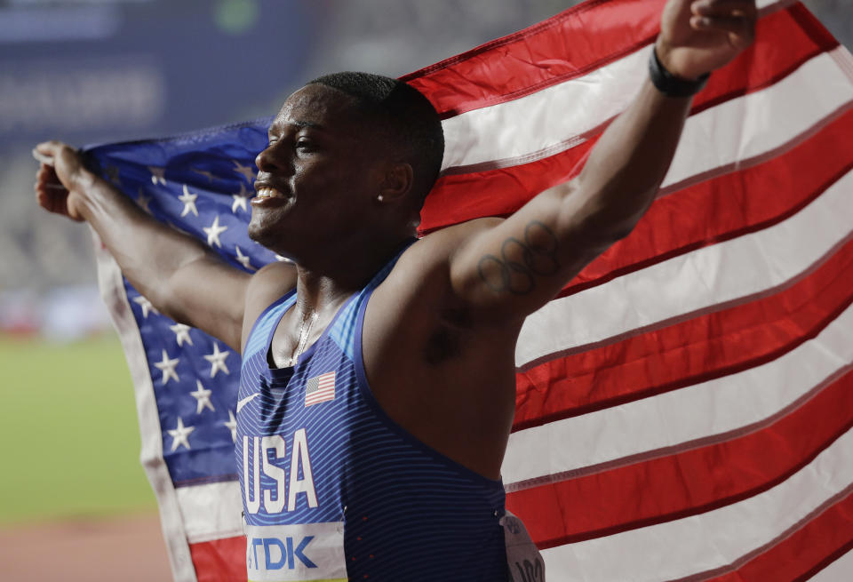 Christian Coleman, of the United States, celebrates winning the gold medal in the men's 100m final at the World Athletics Championships in Doha, Qatar, Saturday, Sept. 28, 2019. (AP Photo/Nariman El-Mofty)