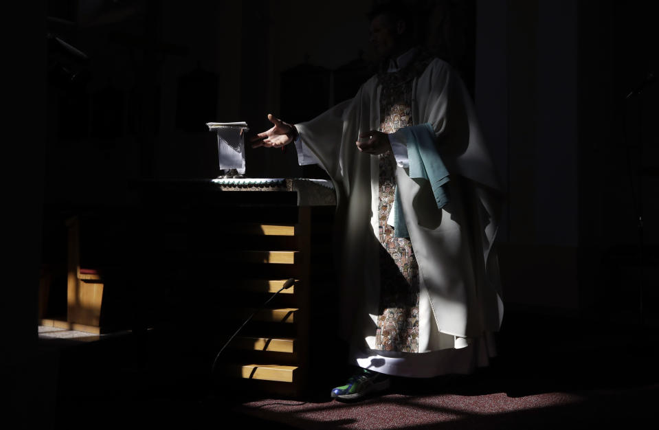 Roman Catholic priest Michal Lajcha serves a mass in a church in Klak, Slovakia, Monday, Sept. 17, 2018. Lajcha is challenging the Roman Catholic Church’s celibacy rules in a rare instance of dissent in the conservative religious stronghold in central and eastern Europe. (AP Photo/Petr David Josek)