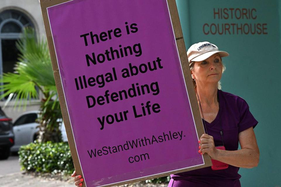 Supporters of Ashley Benefield march in downtown Bradenton ahead of her trial scheduled for July 22. Benefield is charged with second-degree murder for allegedly shooting her estranged husband in Sept. 2020.