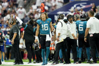 Jacksonville Jaguars quarterback Trevor Lawrence (16) walks back to the bench after throwing an interception against the Houston Texans during the second half of an NFL football game Sunday, Sept. 12, 2021, in Houston. (AP Photo/Sam Craft)